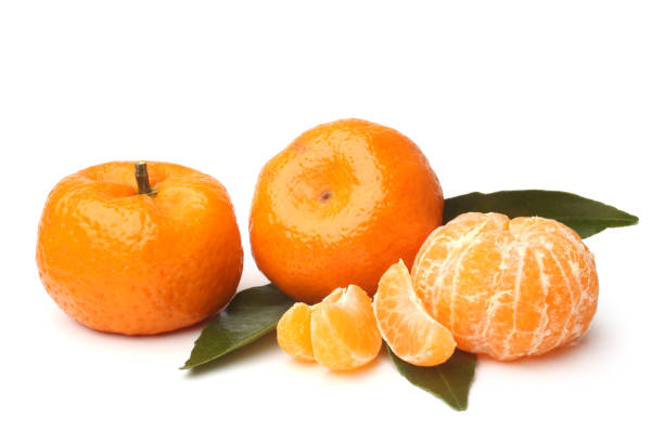 istock Ripe tangerines with green leaves 909652118