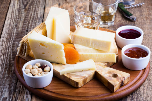 cheese, fruit jam, nuts and wine on wooden board - italian cuisine wine food pasta imagens e fotografias de stock