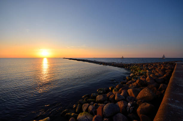 istock sunset at the sea shore 909655030