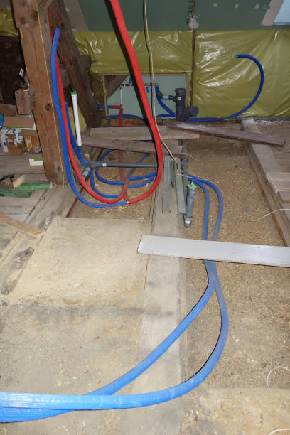 istock Plumbing pipes exposed in future bathroom 909661238