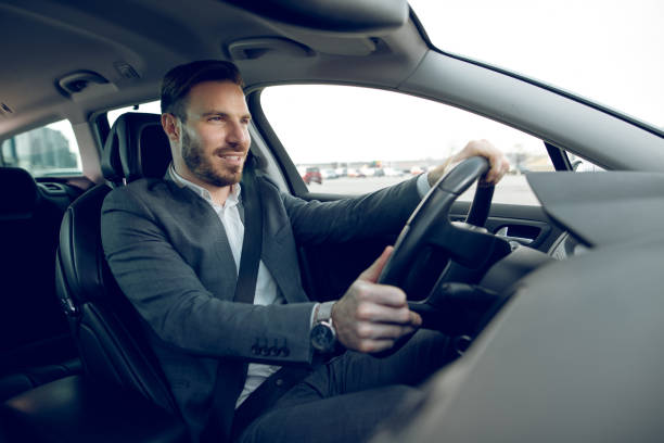 istock Businessman driving a car 909664904