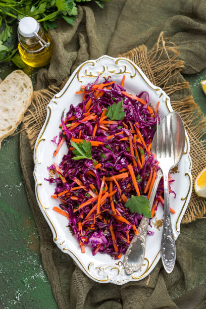 istock Red cabbage coleslaw salad with carrots 909670642