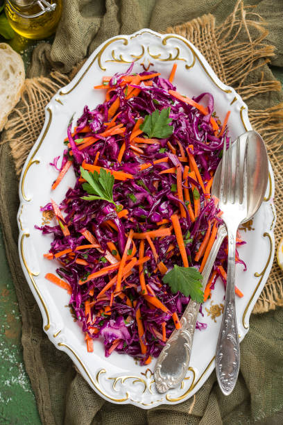 istock Red cabbage coleslaw salad with carrots 909670836