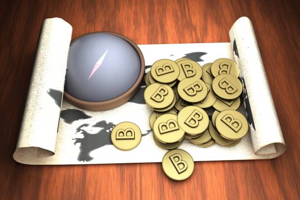 istock Map and compass with bitcoin golden money 909671234