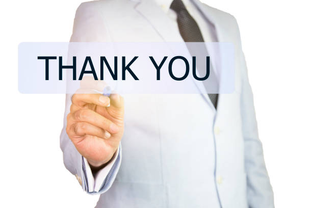 istock Businessman hand touching THANK YOU button on virtual screen 909671260
