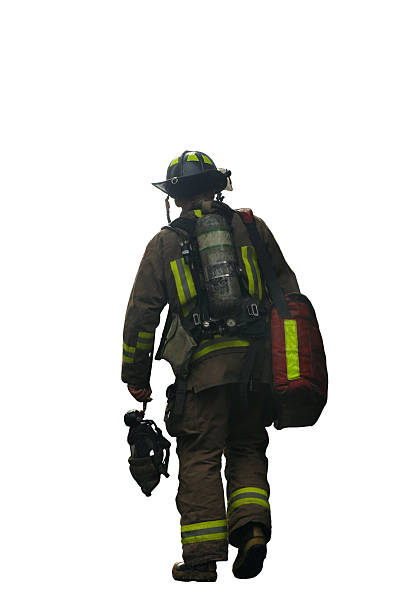 Rear view of a fully equipped firefighter isolated on white
