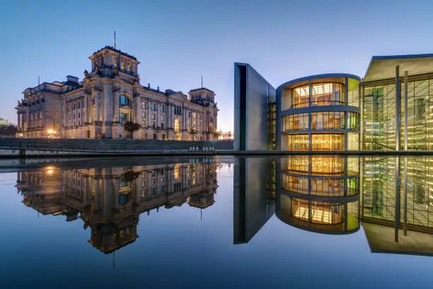 The famous Reichtsag and the Paul-Loebe-Haus at the river Spree in Berlin at dawn