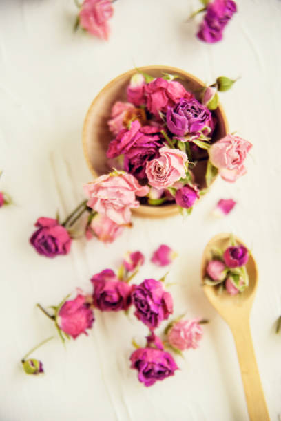 istock Dried rose petals: for tea, alternative medicine, pot-pourri. Copy space. 909675412