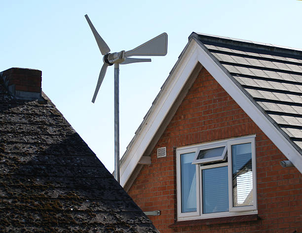 istock Wind turbine generator on house roof 90967703
