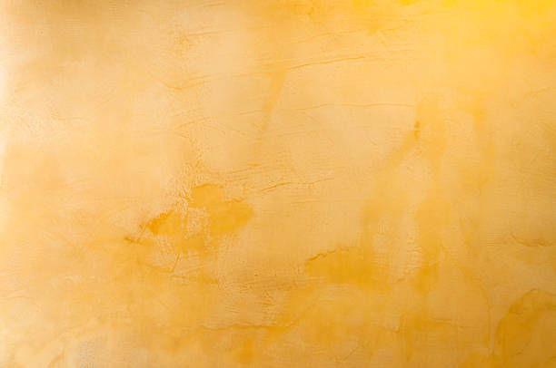 istock Texture of a yellow concrete as a background 909680600