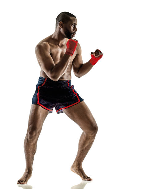 istock Muay Thai kickboxing kickboxer thai boxing man isolated 909681144