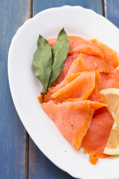 istock salted salmon with lemon on white dish 909681310
