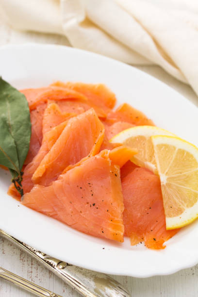 istock salted salmon with lemon on white dish 909681312