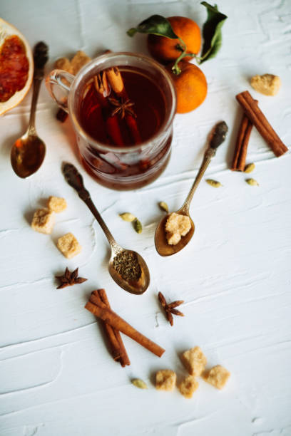 istock Cup of herbal tea on dark aged rustic background, top view, place for text, border 909681670
