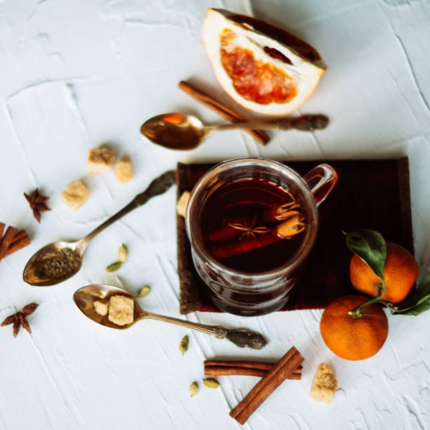 istock Cup of herbal tea on dark aged rustic background, top view, place for text, border 909681714