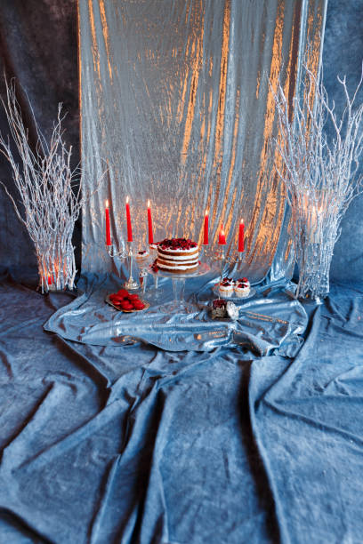 istock Delicious berry cake, macaroons and muffins on a silver background 909681758
