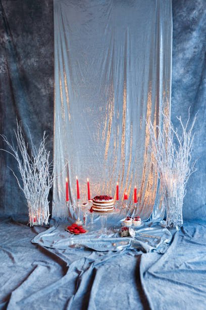 istock Delicious berry cake, macaroons and muffins on a silver background 909682050