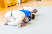 Three Senior Judo Fighters Bowing Down