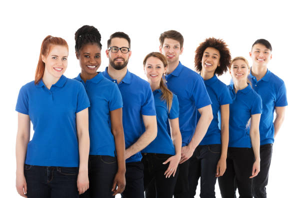 istock Group Of Young Janitors Standing In Row 909683170