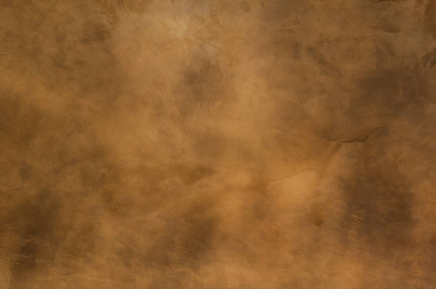 istock Texture of a orange brown concrete as a background 909683576