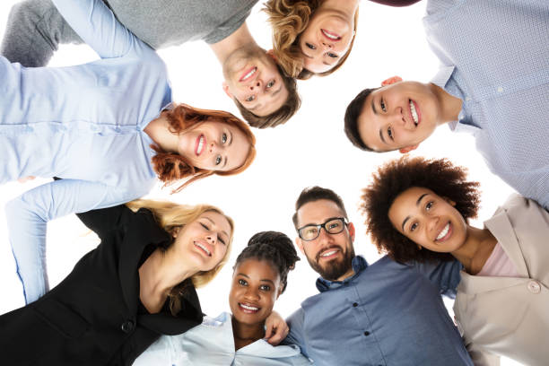 istock Group Of College Students Forming Huddle 909688856