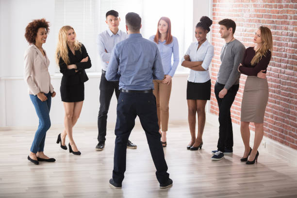 istock Manager Having Conversation With His Business Colleagues 909688882