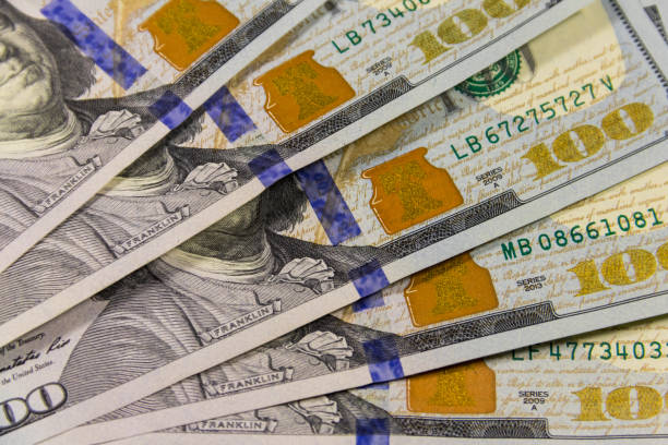 istock Background of one hundred dollar bills 909696178