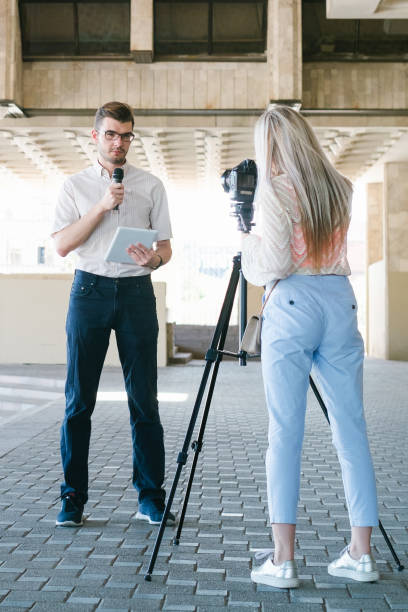 istock news report filming crew teamwork 909696296