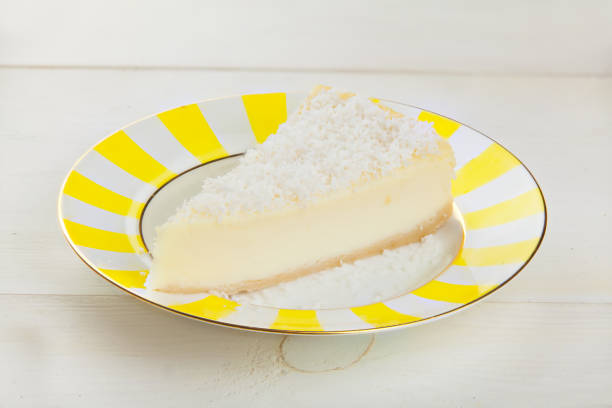 istock delicious cheesecake with coconut on  plate 909699218