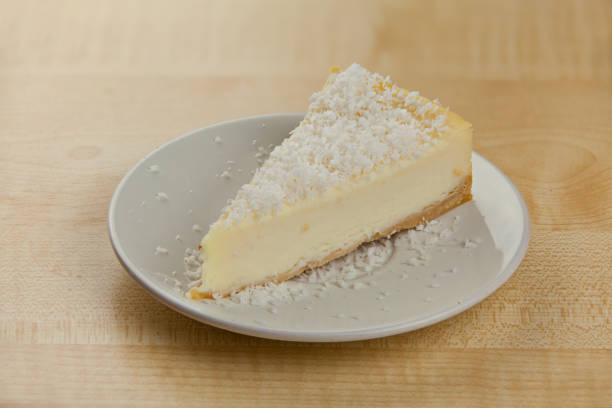 istock delicious cheesecake with coconut on  plate 909699380