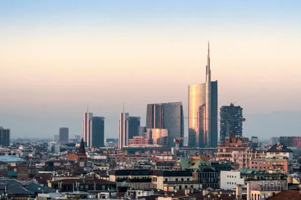 Photo of Milan cityscape at sunset with new skyscrapers of Porta Nuova financial and business district