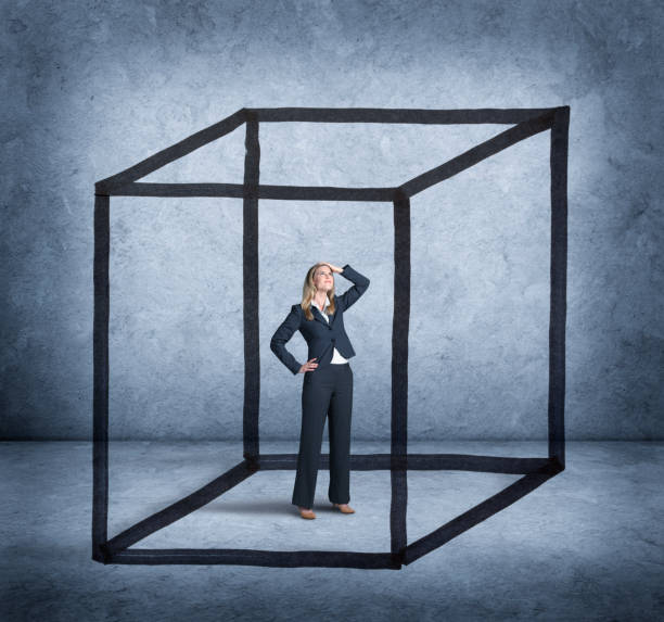 istock Woman Feeling Boxed In By Cube Drawn Around Her 909701406