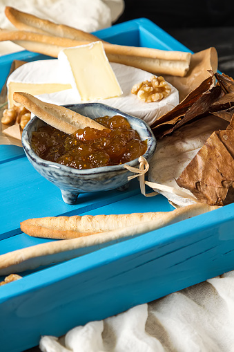 French national food. Cheese with mold. A delicious appetizer for wine. Doux et cremeux, munster cerome, Banon