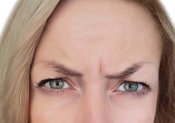 A fisheye image of a crying young woman.