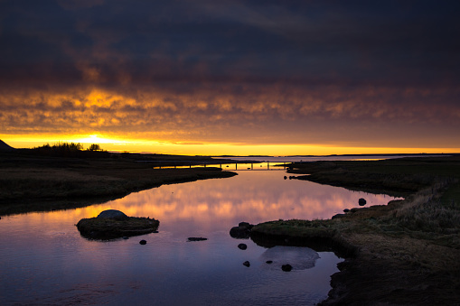 A winding river in western Iceland at sunset. Part of a series.