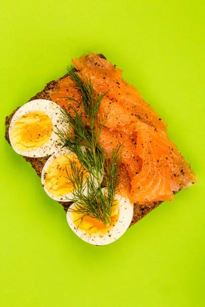 Photo of Smoked Salmon With boiled Eggs Open Face Sandwich On Rye Bread