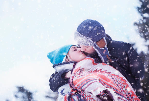 istock Happy couple outdoors in winter 909718450