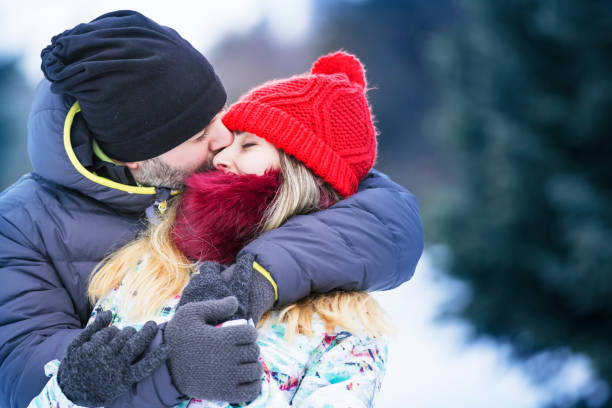 istock Happy couple outdoors in winter 909718816