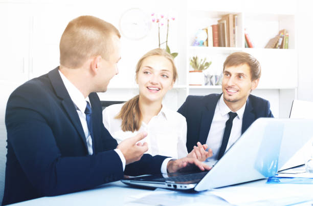 istock Coworkers chatting about business project 909721874