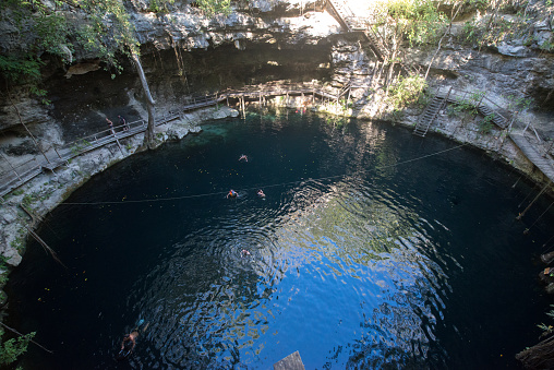 Ek Balam, Mexico, circa january 2017: Xcanche Cenote in Mexico, Yucatan. A cenote is a natural pit, or sinkhole, resulting from the collapse of limestone bedrock that exposes groundwater underneath