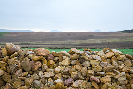 On an overcast day this is mainly a photo of rocks cobbled together in Spain on the Camino Santiago