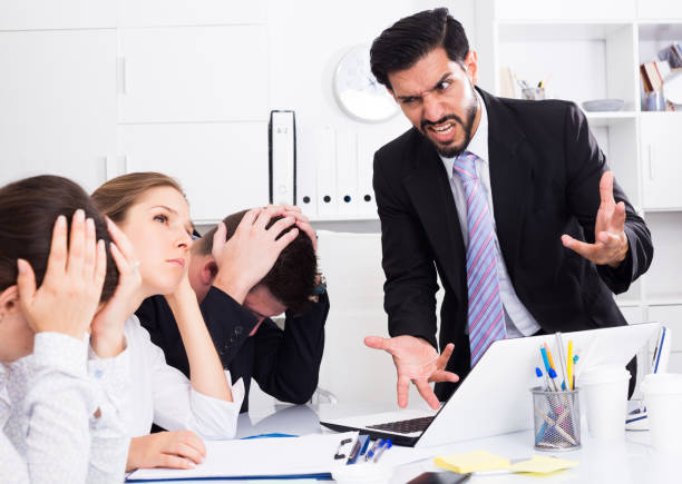 istock Outraged manager with colleagues at meeting 909734922