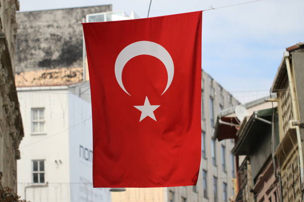 istock Turkish flag and some roof tops 909735792