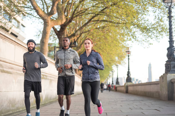 istock Friends jogging on promenade 909740872