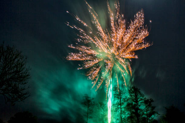 Fireworks at New Year Firework - Explosive Material, Firework Display, New Year's Eve, Winter, Fire - Natural Phenomenon long exposure winter crowd blurred motion stock pictures, royalty-free photos & images