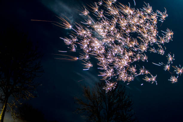 Fireworks at New Year Firework - Explosive Material, Firework Display, New Year's Eve, Winter, Fire - Natural Phenomenon long exposure winter crowd blurred motion stock pictures, royalty-free photos & images