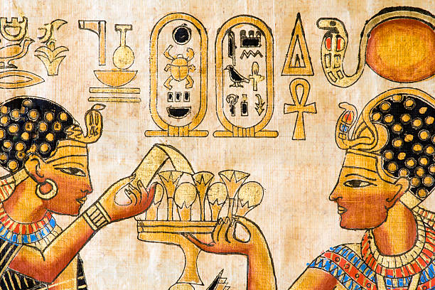 Fragment of Egyptian papyrus Fragment of ancient Egyptian painting on papyrus. This is a souvenir replica from a market in Cairo hieroglyphics photos stock pictures, royalty-free photos & images