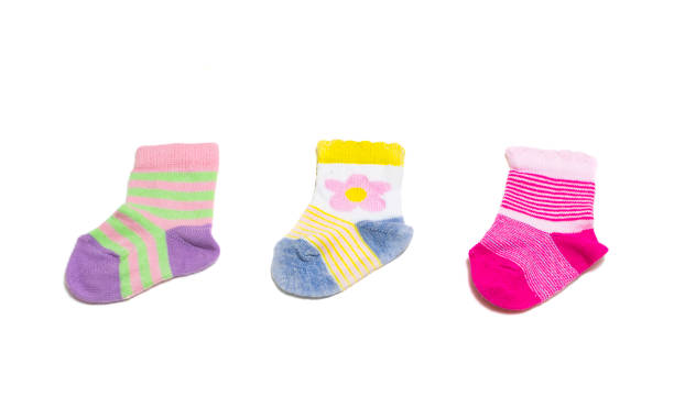 istock Colorful baby socks isolated on white background 909748754