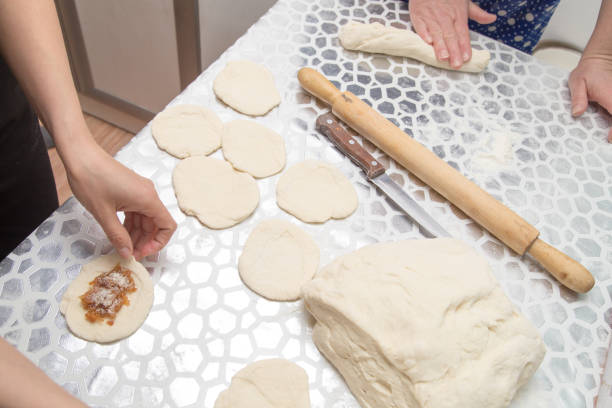 istock cooking cakes of the dough in the kitchen 909750312