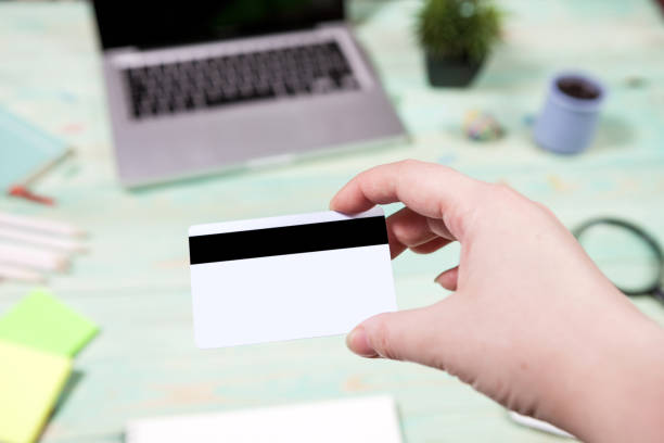 istock A man is going to pay for the goods in the internet using credit card and laptop computer. 909751992